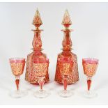 PAIR OF BAVARIAN RUBY AND PARCEL GILT DECANTERS