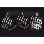 THREE SILVER PLATED TOAST RACKS