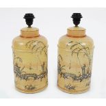 PAIR OF CREAM TOLEWARE CADDY STEMMED TABLE LAMPS