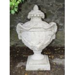 PAIR OF MOULDED STONE NEOCLASSICAL URNS