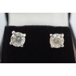 18 CT. WHITE GOLD AND DIAMOND STUD EARRINGS