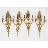 SET OF FOUR GILT BRONZE WALL APPLIQUES