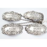 FOUR STERLING SILVER DECANTER LABELS