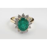 18 CARET GOLD EMERALD AND DIAMOND RING