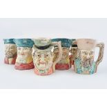 SET OF SEVEN POLYCHROME CHARACTER JUGS