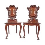 PAIR OF ARMORIAL BACK MAHOGANY HALL CHAIRS