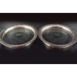 PAIR OF SILVER AND CRYSTAL WINE COASTERS