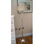 DESIGNER GLASS AND POLISHED STEEL STANDARD LAMP