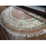 Pink ground circular Chinese rugs (2) (72" diameter)