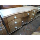 Victorian pine serpentine sideboard with pot knobs