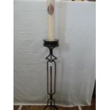 Wrought iron church candle stand with candle