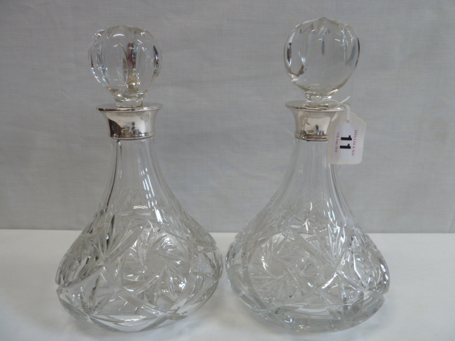 Pair silver topped cut glass ship's decanters (London 1972)