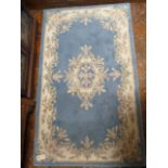 Blue ground Chinese rug (59" x 35")