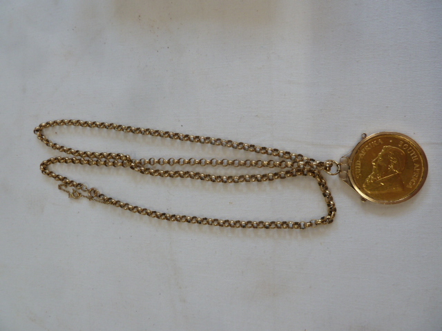 1974 Krugerrand in 9ct gold pendant mount attached to 9ct gold necklace