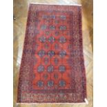 Red ground Afghan rug (60" x 36")