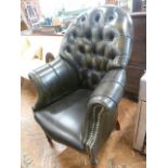 Green leather buttoned and studded library armchair