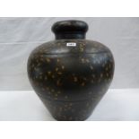 Large metal globular vase with cave painting style tribal decoration