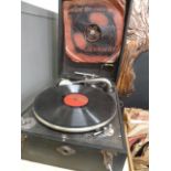 Early 20thC portable picnic gramophone player and box of 78 records