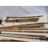 Vintage cane fishing rods, racquets,