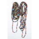 Konvolut KettenWestafrika, 20. Jh., ca. 13 Stück, verschieden geformte aufgefädelte Perlen, meist