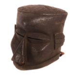 Helmmaske der KubaDR Kongo, Holz geschwärzt und Raffiakordeln, H: 28 cm.- - -25.00 % buyer's premium