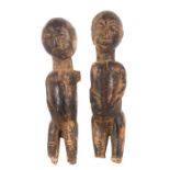 Zwei kleine Standfigurenafrikanisch, Holz geschwärzt, H: ca. 21 cm.- - -25.00 % buyer's premium on