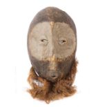 Maske der LegaDR Kongo, Holz mit gekalkten Augenpartien, mit Faserbart, H: 87 cm.- - -25.00 %