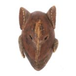 TiermaskeWestafrika, Holz, rotbraun und schwarz eingefärbt, H: 32 cm.- - -25.00 % buyer's premium on