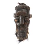 Helmmaske der KubaDR Kongo, Holz, mit Fellbesatz und Pflanzensamen, H: 50 cm.- - -25.00 % buyer's