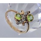 DAMENRING585/000 Rotgold mit 2 Peridots und kleinen Diamanten. Gr. 58, Brutto ca. 3,8g