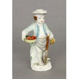 PUTTOKPM Berlin, 20.Jh. Polychrom staffierte Kinderfigur mit Korb und Spaten. Entwurf Johann Elias