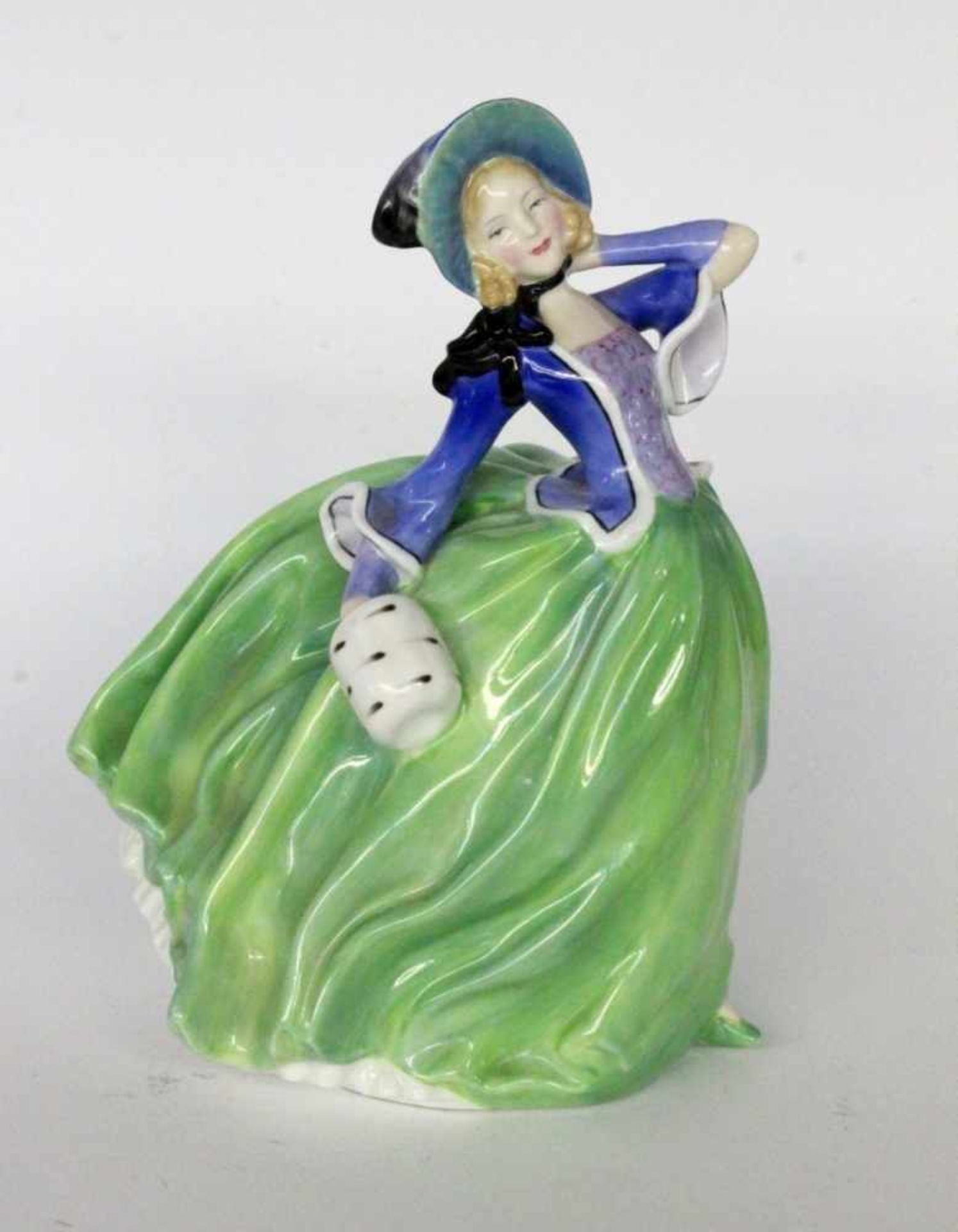 ROYAL DOULTON FIGUREngland "Autumn Breezes". Bunt staffierte Frauenfigur. Manufakturmarke. H.20cmA