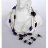 HLASKETTE UND ARMBAND MIT AMETHYSTEN.Zwischenglieder 333/000 Gelbgold. L.85/20cmA NECKLACE AND A