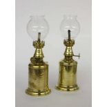 A PAIR OF PARAFFIN LAMPS 20th century Brass. Height approximately 23 cm. Condition: oneshade with