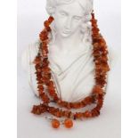 A CARNELIAN NECKLACE 82 cm long. Includes a pair of drop earrings, carnelian with silver.HALSKETTE