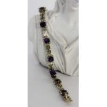 A BRACELET 585/000 white gold with dark purple amethysts and diamonds. 20 cm long, grossweight
