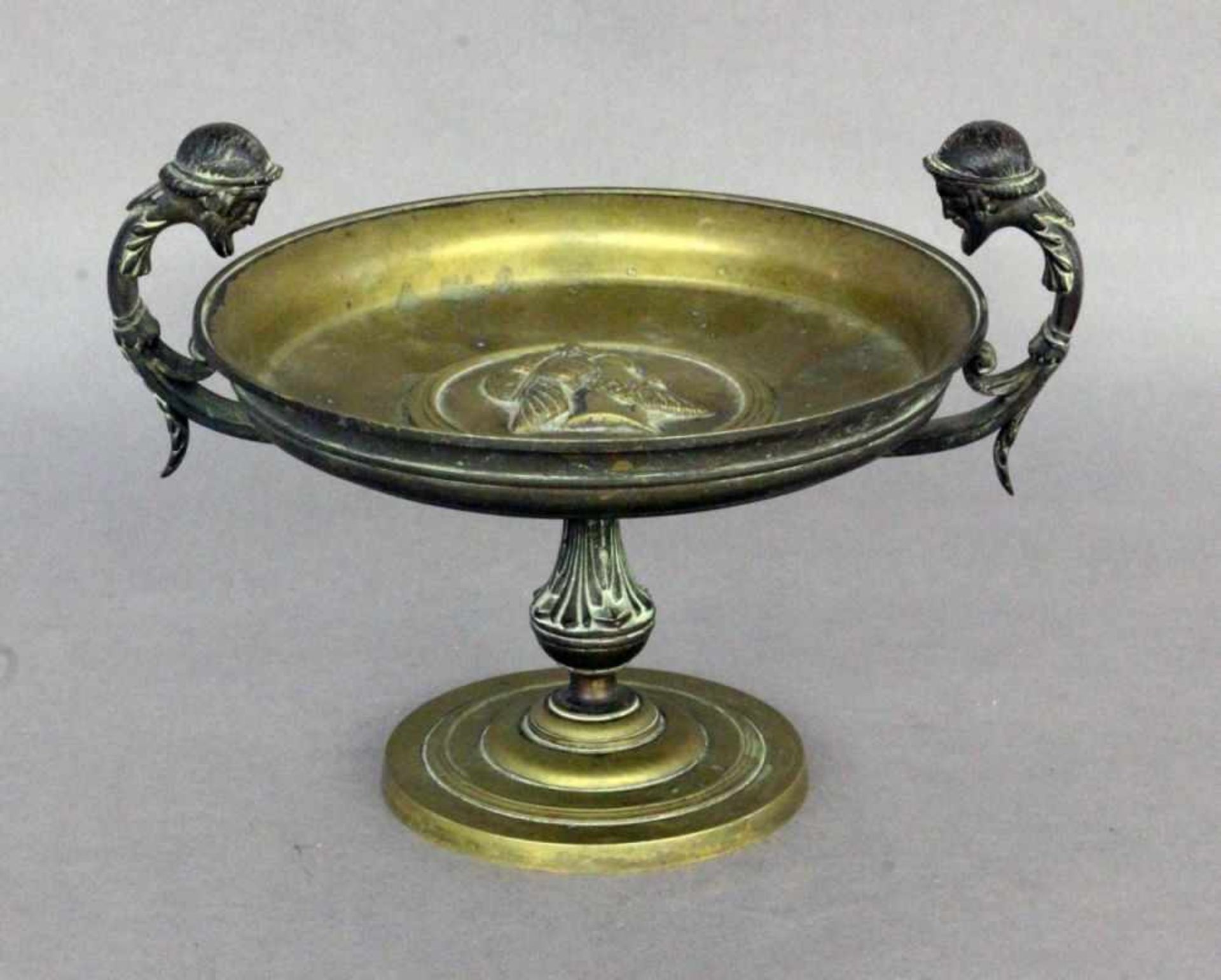 A CENTREPIECE 19th century Bronze bowl in antique style with decorative handles in theshape of