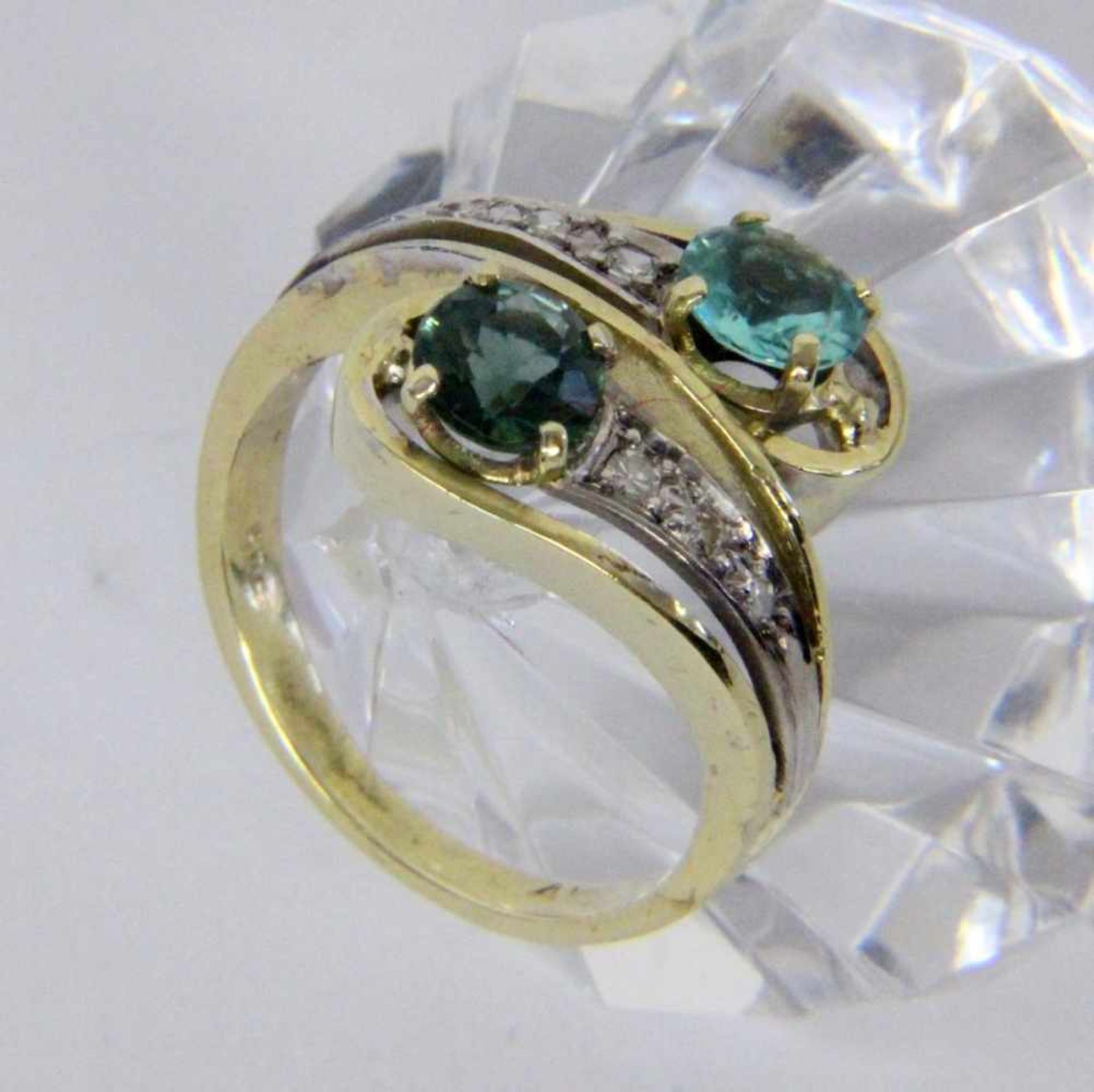 A LADIES RING 585/000 yellow gold with zircon, tourmaline and brilliant cut diamonds. Ringsize 55,