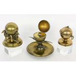 A LOT OF THREE ENGLISH INKWELLS circa 1880 Brass balls with unusual sculptural animalmotifs.