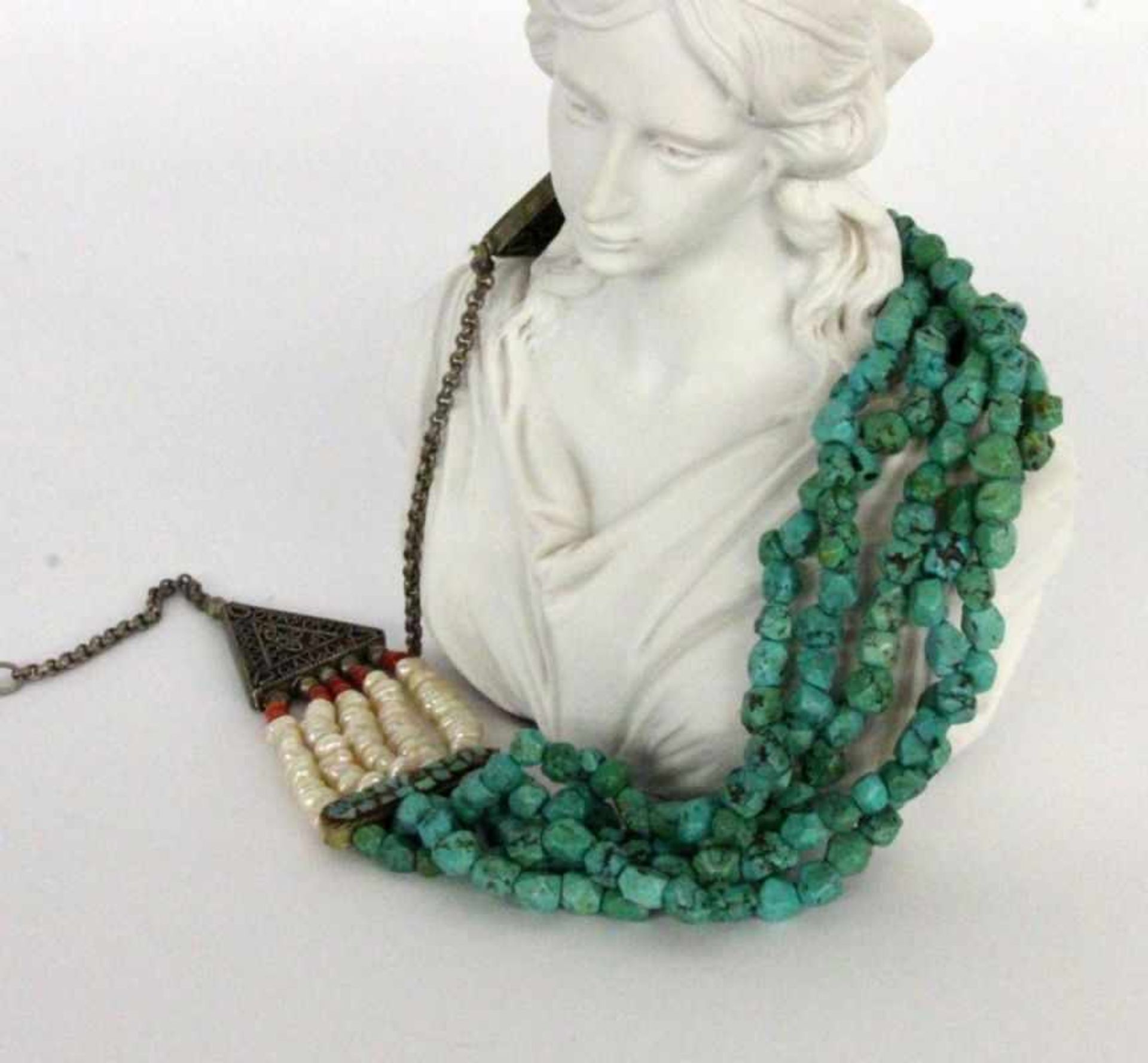 AN ORIENTAL WEDDING NECKLACE Silver with turquoise, pearls and corals, 40 cm long.ORIENTALISCHE