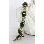 A BRACELET Gilt silver with jade cabochons. 18.5 cm longARMBANDSilber vergoldet mit Jadecabochons.