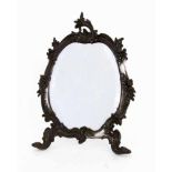 A ROCOCO TABLE MIRROR France, 19th century Tin frame with remnants of silvering, featuringfloral