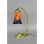 AN ART NOUVEAU TABLE LAMP probably Daum, Nancy circa 1920 Ornate brass mount with curvedarm and an
