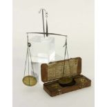 AN OLD COIN SCALE France, 18th/19th century Iron with 2 brass trays and weights. Case madeof oak
