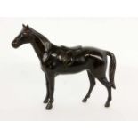 A SADDLE HORSE Circa 1900 A patinated bronze saddled horse. 18.5 cm high.REITPFERDUm 1900 Patinierte