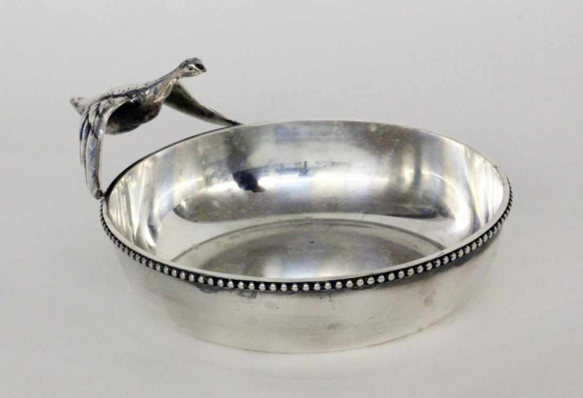 A SWEET BOWL Orfevrerie Beard, Montreux Silver-plated metal. Handle in the form of aflying bird.