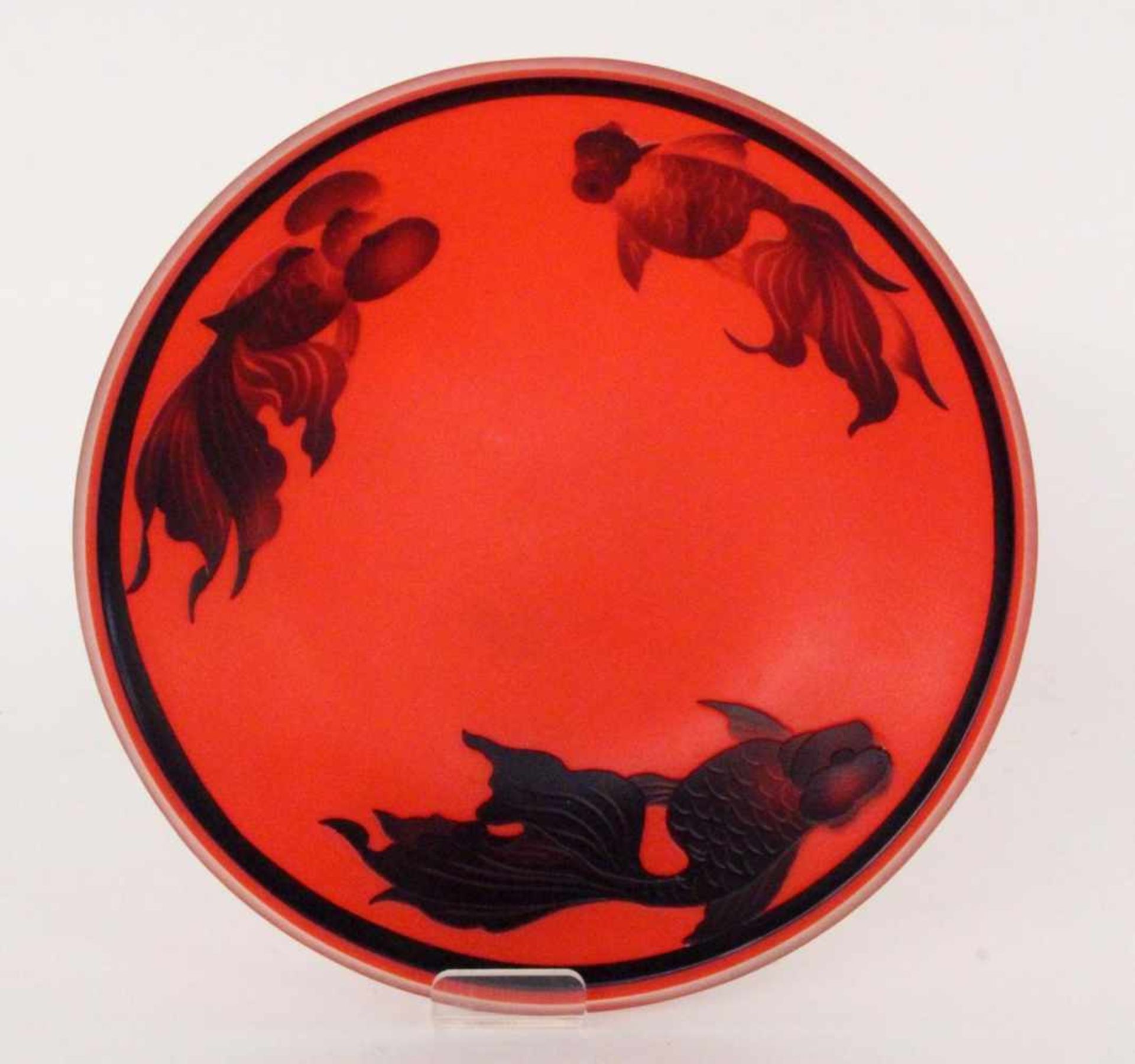 A GLASS BOWL probably Japan Orange-red glass with black overlay and etched koi carp.Diameter 20.5