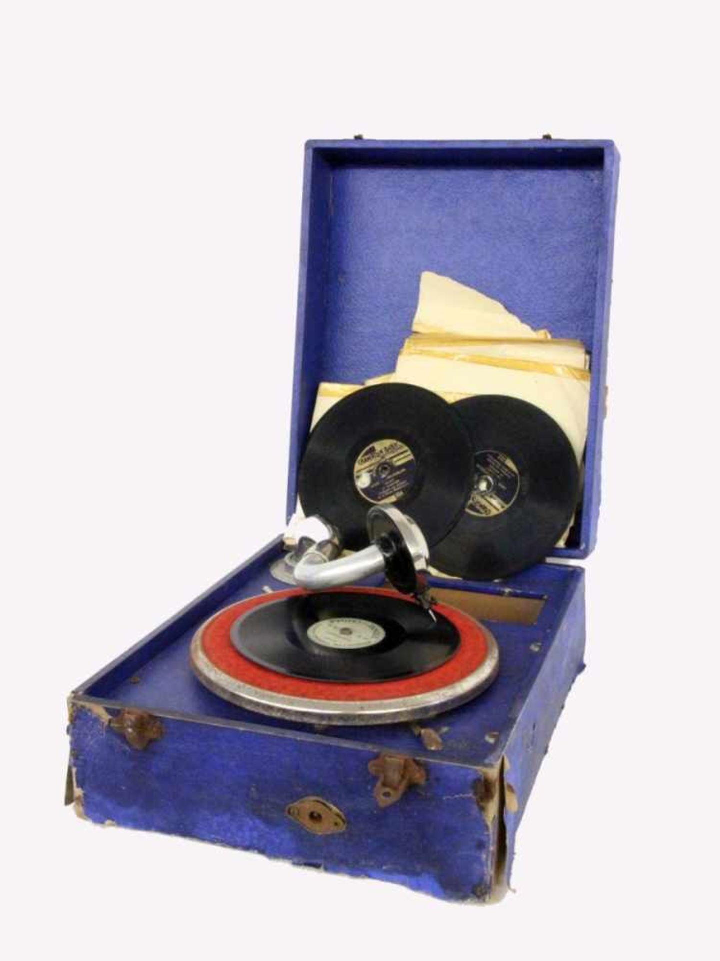 AN ORPHÉE TRAVEL GRAMMOPHONE 1920s In a box with 8 records. Condition: signs of wear andtear.