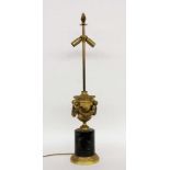 AN EMPIRE LAMP STAND France, 20th century Vase-shaped body with sculptural garlands ofgilt bronze.