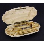 A GOLDEN MANICURE SET IN IVORY CASE France 1847 - 1919 Complete 7-piece manicure set madeof 750/
